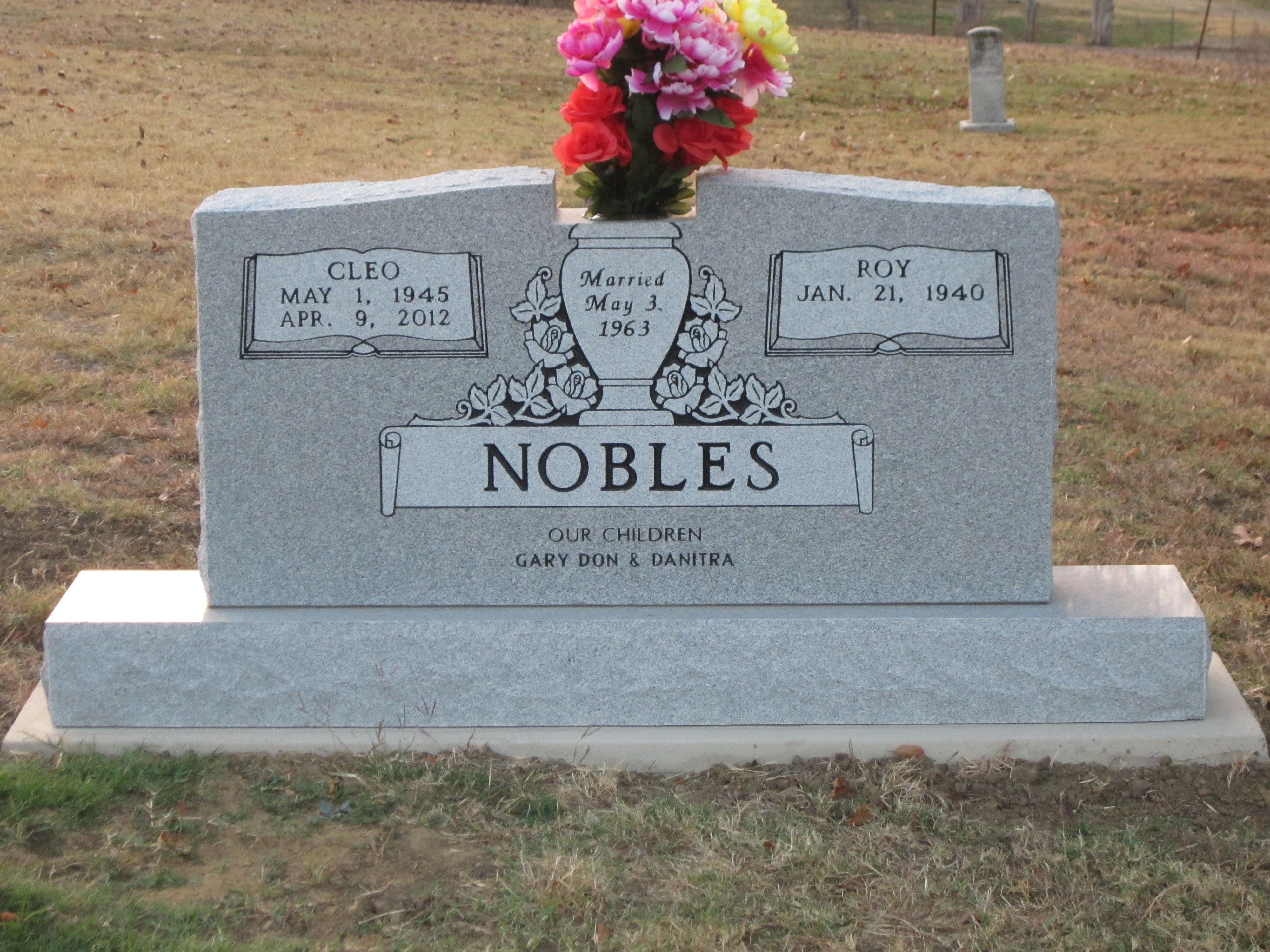 Granite headstone with fresh flowers